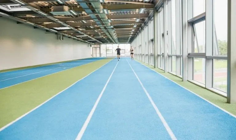 Indoor running track design and layout considerations for project planning  - Sports Venue Calculator