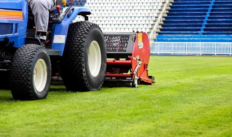 synthetic turf field maintenance machine