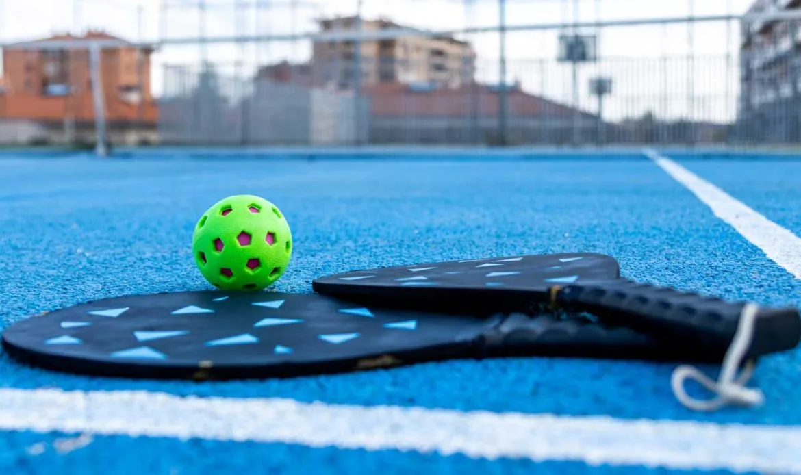 Pickleball paddles on an outdoor court