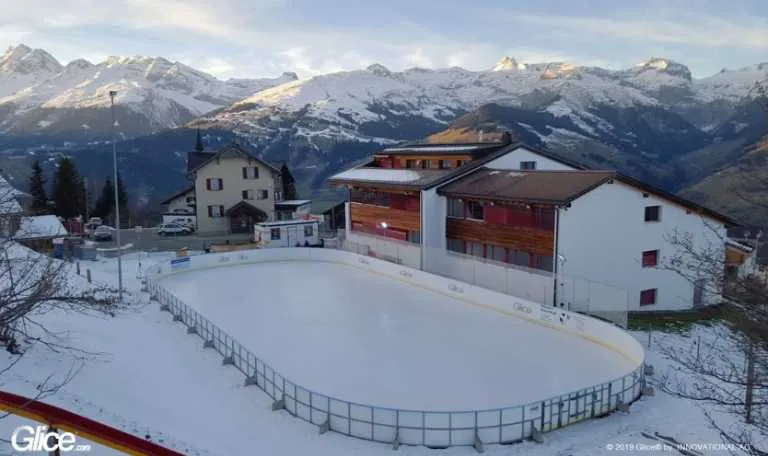 synthetic ice rink with a mountain view