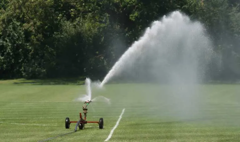 How to Keep Grass From Growing Over Retracting Sprinkler Heads